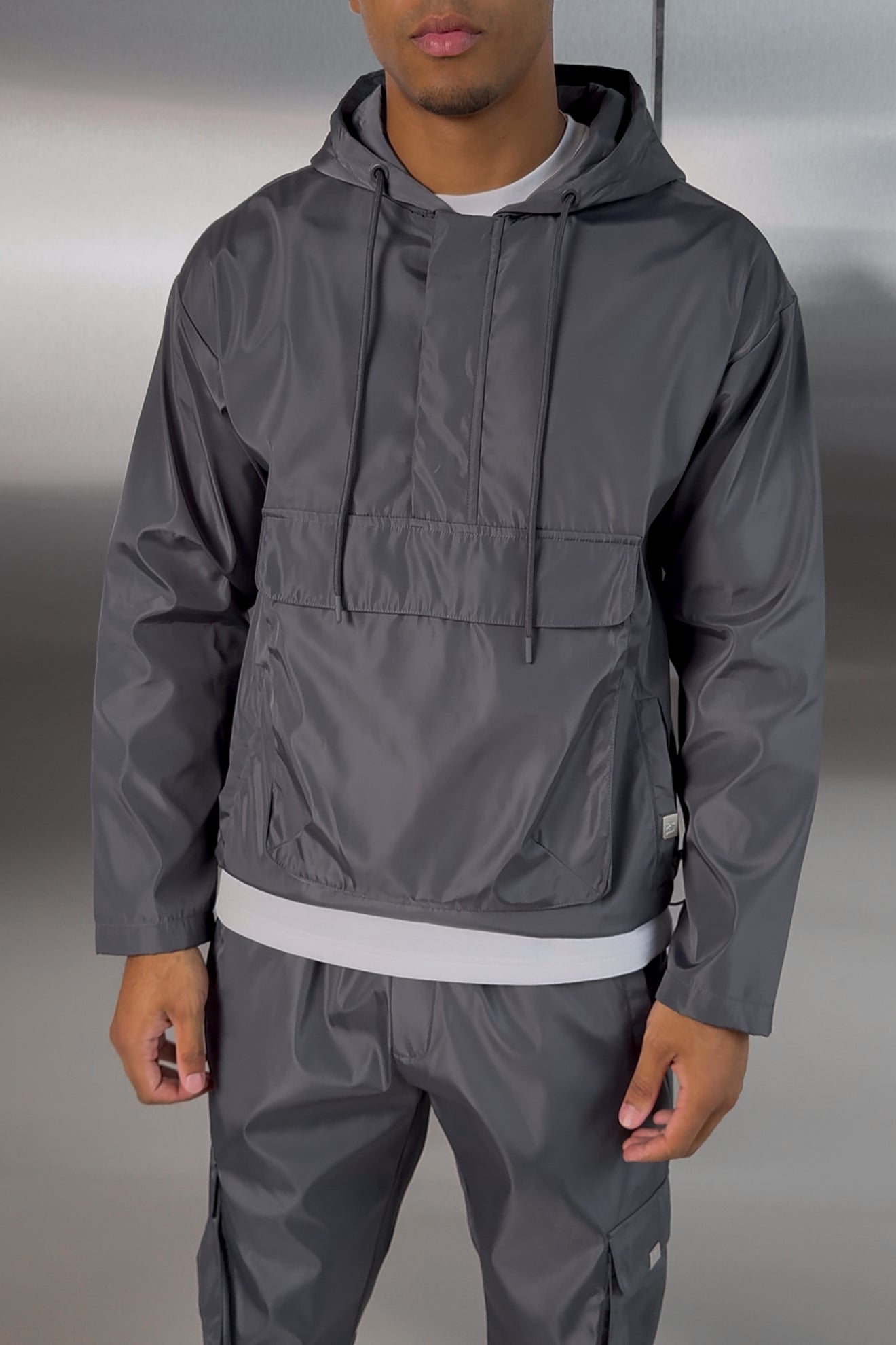 https://cdn.shopify.com/s/files/1/0137/1419/4490/files/NYLONTRACKSUITCHARCOAL-2.jpg?v=1757683010