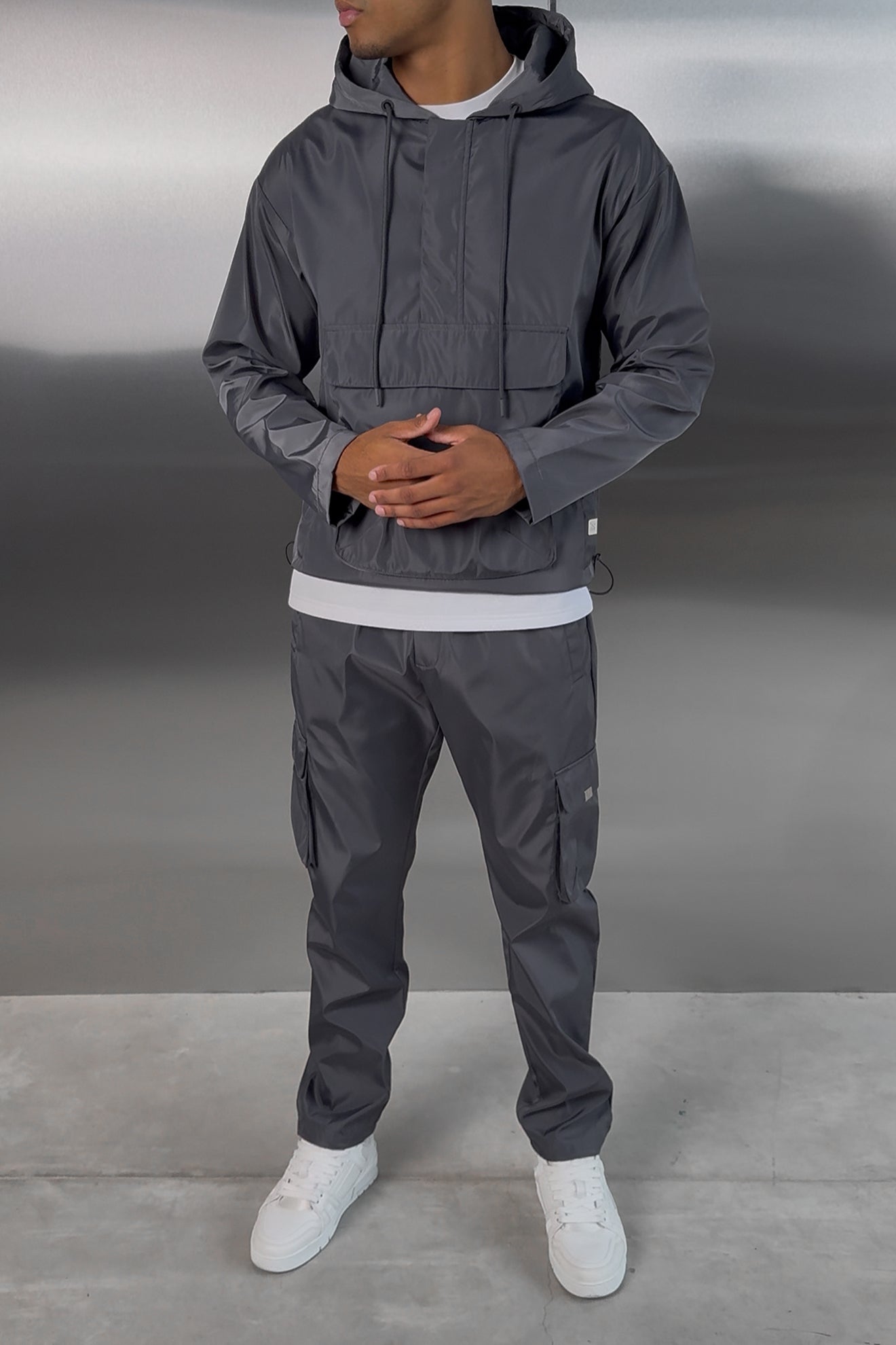 https://cdn.shopify.com/s/files/1/0137/1419/4490/files/NYLONTRACKSUITCHARCOAL-3.jpg?v=1757682966